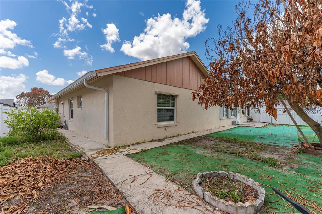 2779 Muscatello Street Orlando, FL 32837 - Photo 36 of 36 a view of a house with a yard