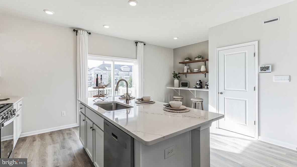 14 Baybreeze Drive Waretown, NJ 08758 - Photo 7 of 27 a kitchen with granite countertop a sink and cabinets