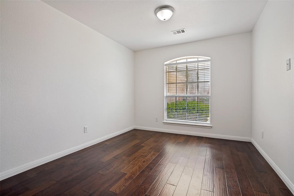 3111 Creekside Drive Sachse, TX 75048 - Photo 12 of 25 Interior room featuring dark wood-finish flooring and a white baseboard