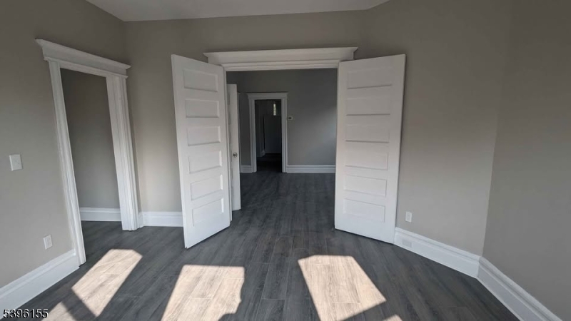 604 South 20th Street, Unit 2 Newark, NJ 07103 - Photo 5 of 10 wooden floor in an empty room