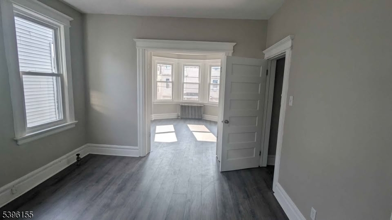 604 South 20th Street, Unit 2 Newark, NJ 07103 - Photo 6 of 10 a view of entryway with wooden floor