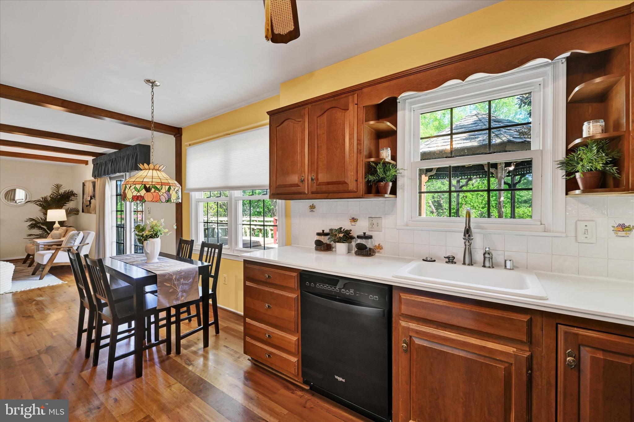 9115 Kilbride Road Baltimore, MD 21236 - Photo 16 of 61 a kitchen with a sink a window and dining table