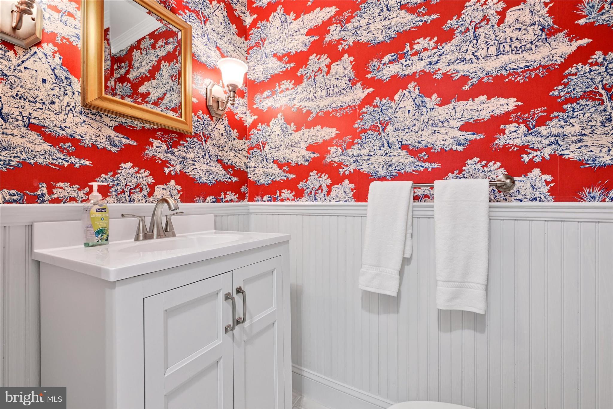 9115 Kilbride Road Baltimore, MD 21236 - Photo 22 of 61 a bathroom with a sink and a mirror