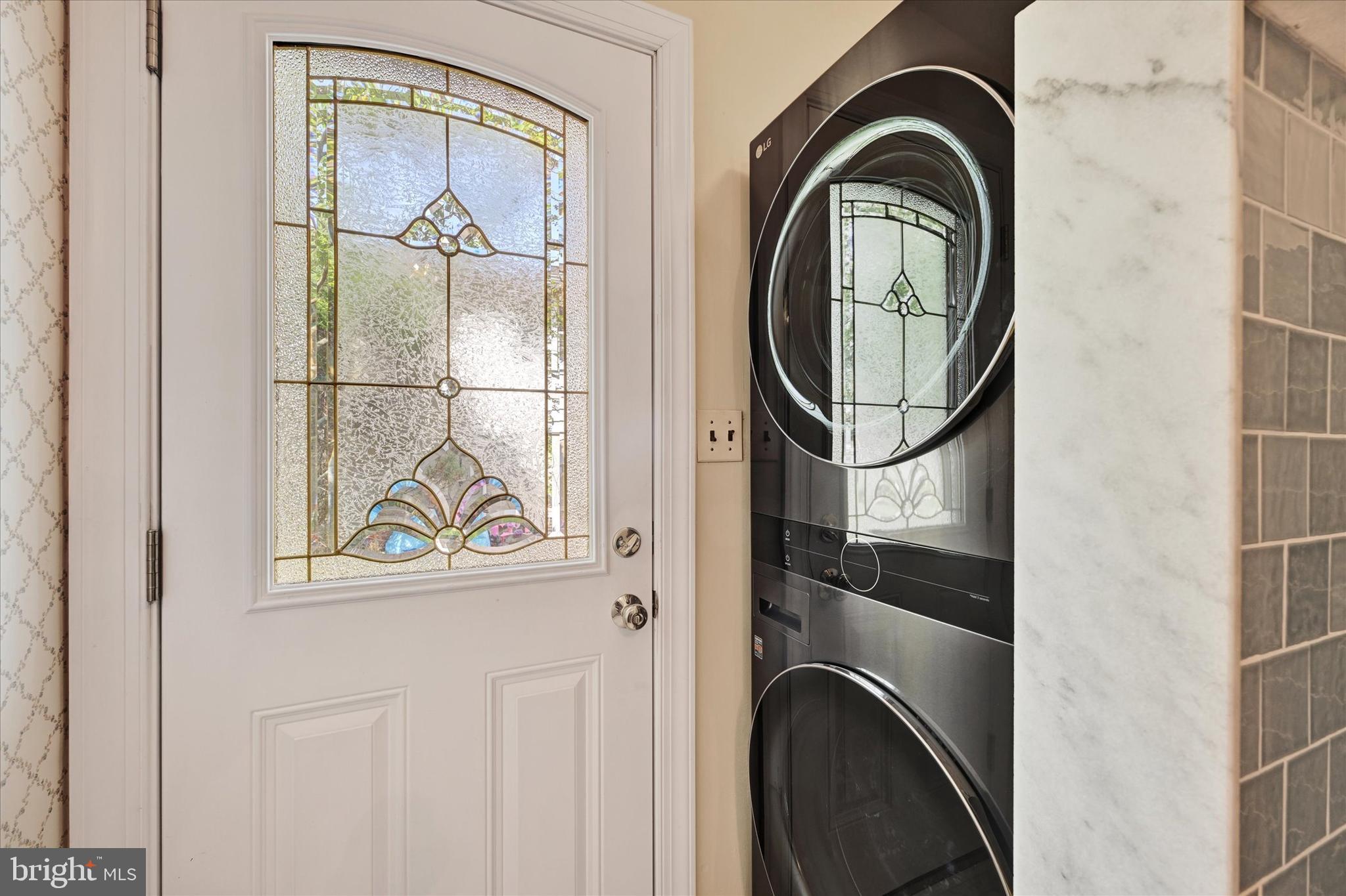 9115 Kilbride Road Baltimore, MD 21236 - Photo 25 of 61 a view of a door with a washer and dryer