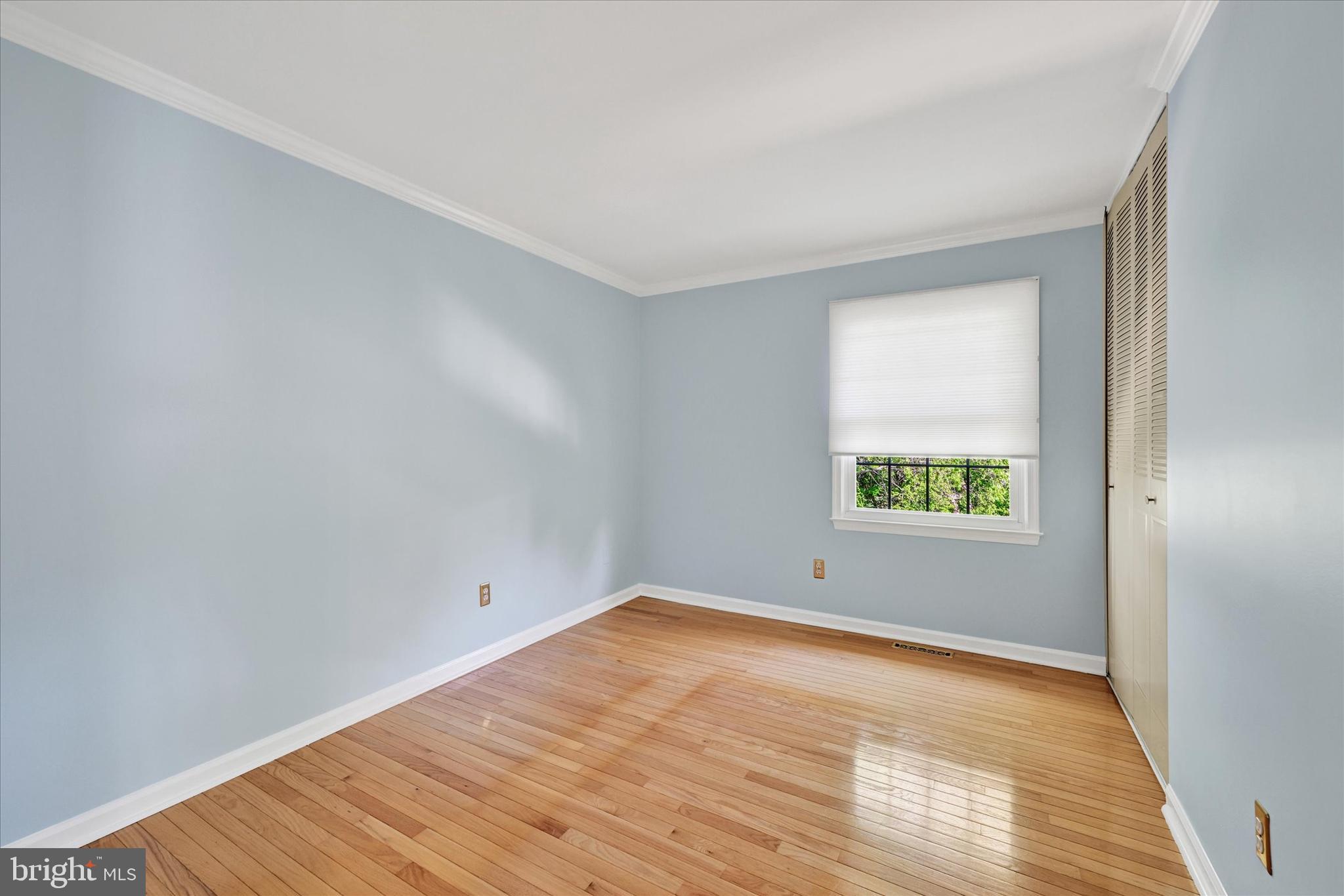 9115 Kilbride Road Baltimore, MD 21236 - Photo 26 of 61 a view of an empty room with wooden floor and a window