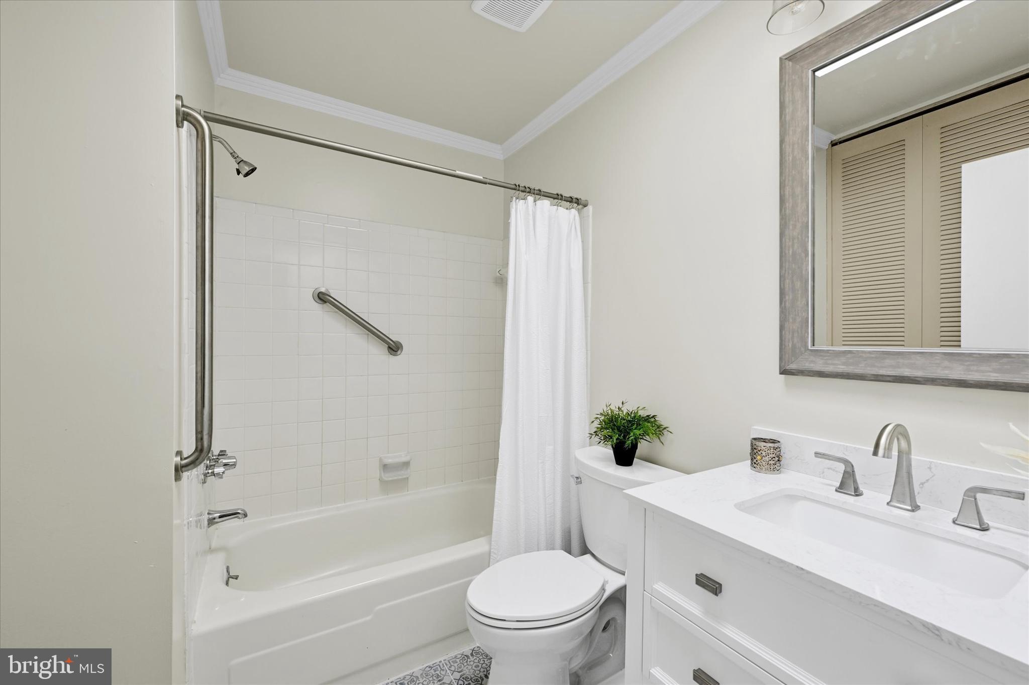 9115 Kilbride Road Baltimore, MD 21236 - Photo 32 of 61 a bathroom with a granite countertop sink a toilet and shower