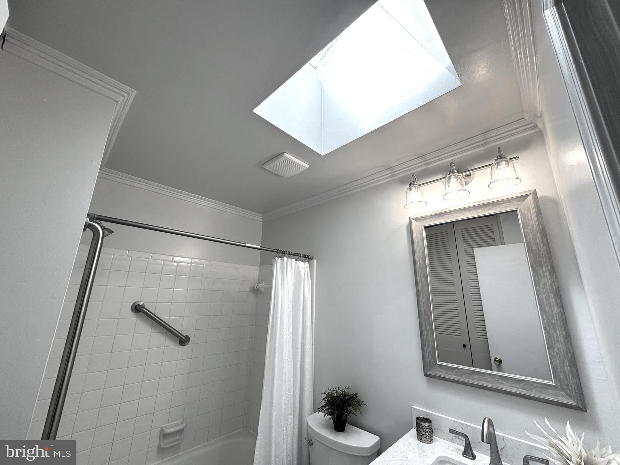 9115 Kilbride Road Baltimore, MD 21236 - Photo 33 of 61 a bathroom with a bathtub a shower and a vanity