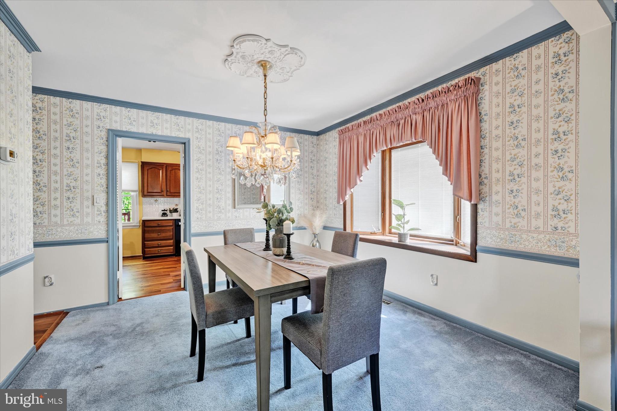 9115 Kilbride Road Baltimore, MD 21236 - Photo 9 of 61 a view of a dining room with furniture window and wooden floor