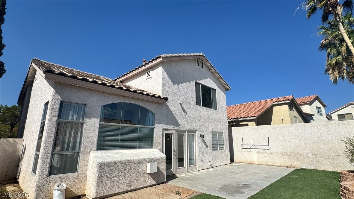 9716 Ridge Creek Place Las Vegas, NV 89134 - Photo 28 of 28 This residence features a tiled roof and a private yard, perfect for outdoor enjoyment.