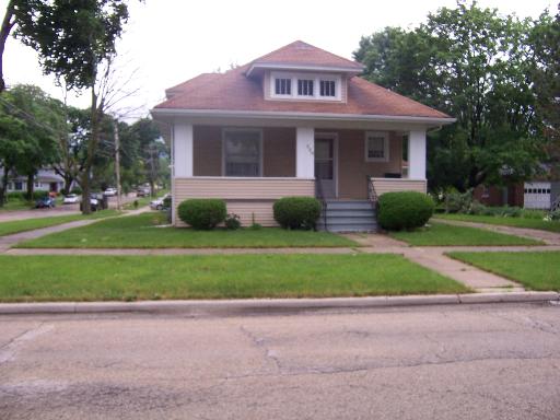 230 Perry Street Elgin, IL 60123 - Photo 1 of 1 a front view of house with yard and green space