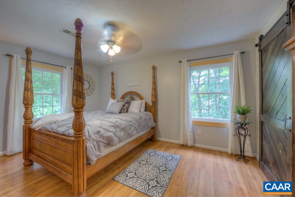 1877 Swift Run Road Ruckersville, VA 22968 - Photo 20 of 40 a bedroom with a bed and a window