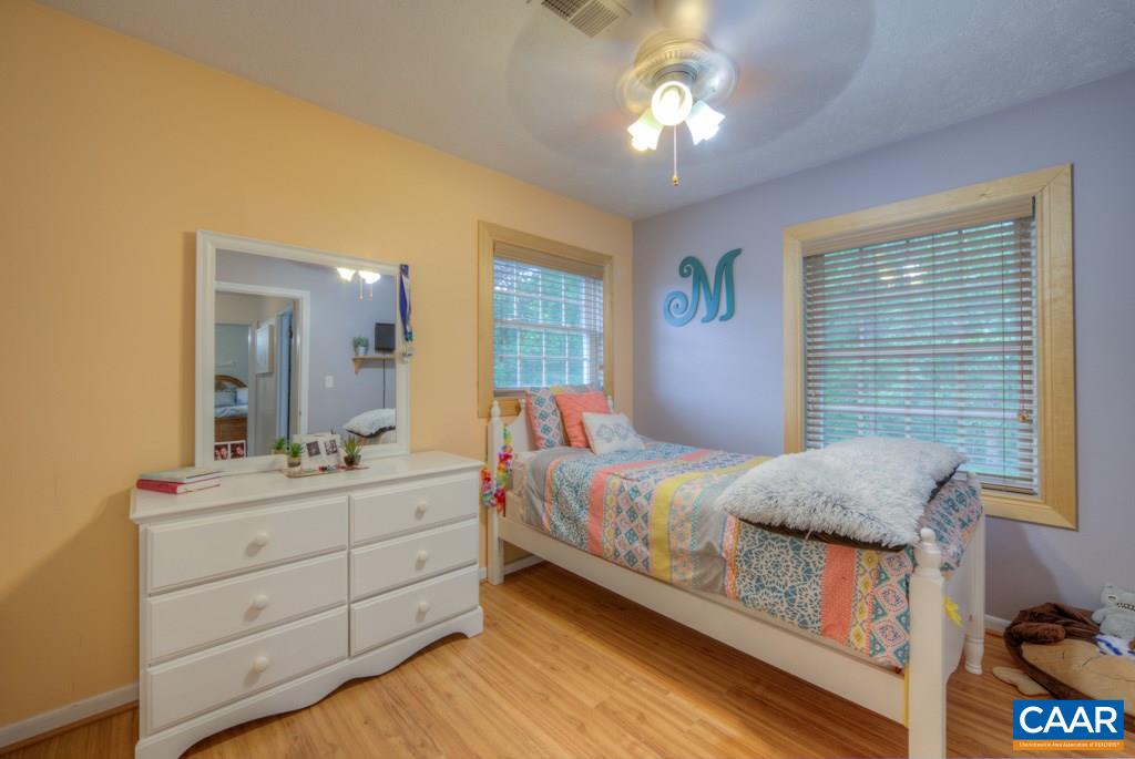 1877 Swift Run Road Ruckersville, VA 22968 - Photo 25 of 40 a bedroom with a bed and a dresser