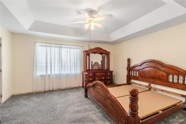 a bathroom with a granite countertop shower and a toilet