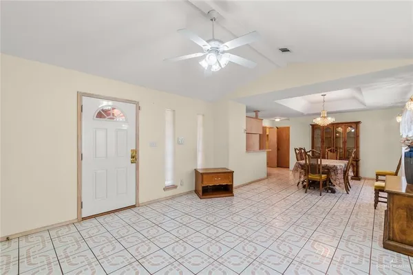 a living room with furniture and white walls
