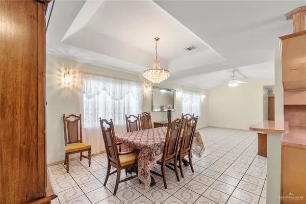 a dining room with furniture and window