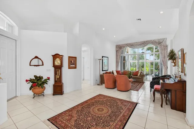 a kitchen with stainless steel appliances and granite countertop a refrigerator and a stove top oven