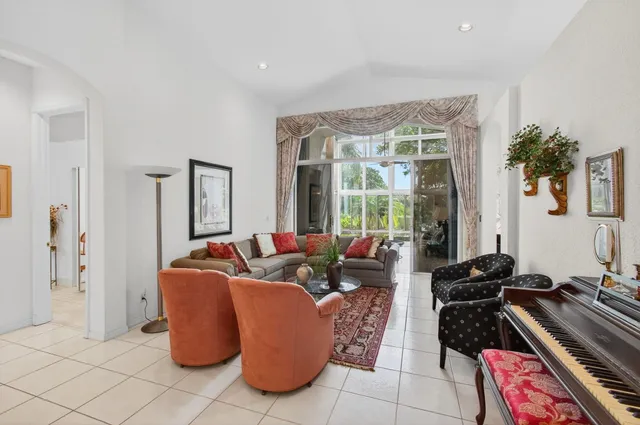 a front view of house with a garden