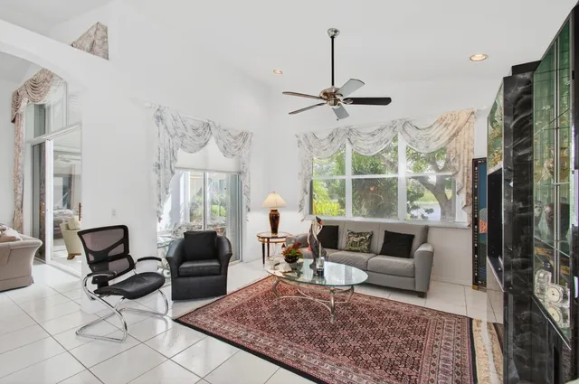 an aerial view of a house with a yard and potted plants
