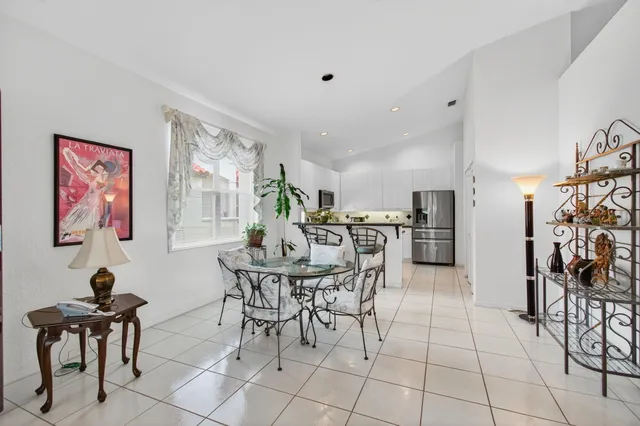 a aerial view of a house with swimming pool and garden