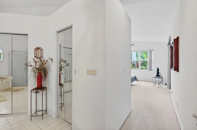 a view of a dining room with furniture a chandelier and wooden floor