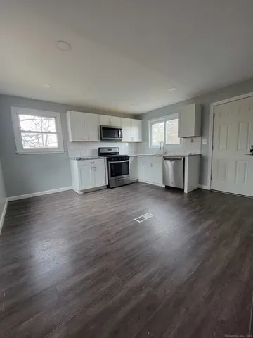 a view of kitchen and windows