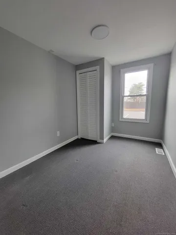 a view of a room that has a window in it