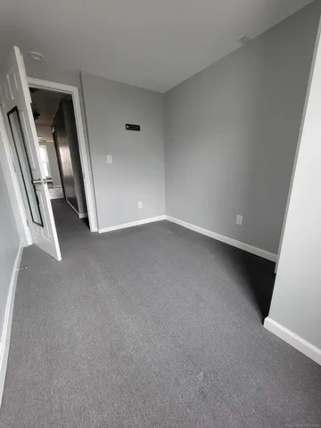 an empty room with staircase