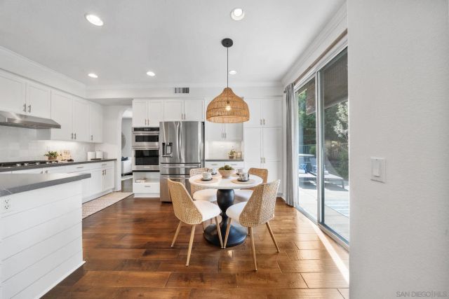 a living room with a bed and a window
