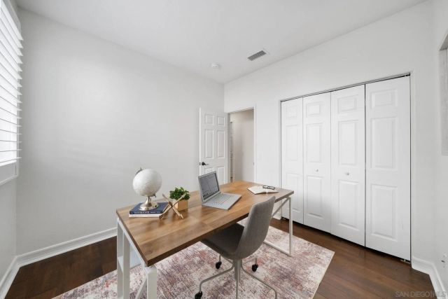 a bedroom with a bed and a closet