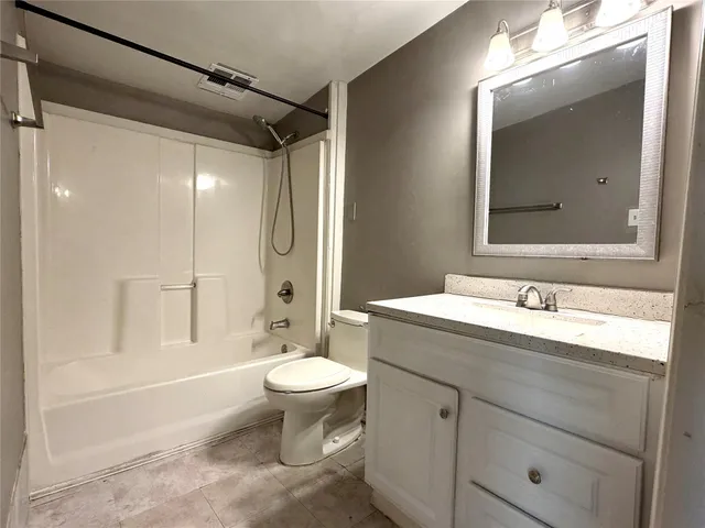 a bathroom with a sink toilet a mirror and shower