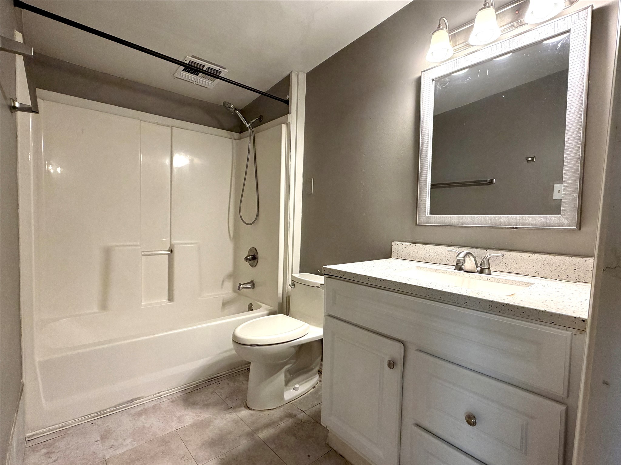 4727 Eppes Street Houston, TX 77021 - Photo 4 of 16 a bathroom with a sink toilet a mirror and shower