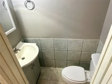 a bathroom with a toilet and a sink