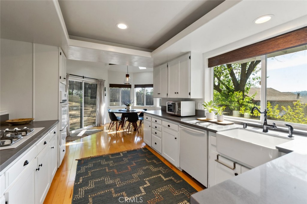 940 Highway 173 Lake Arrowhead, CA 92352 - Photo 12 of 45 a kitchen with appliances a sink and cabinets