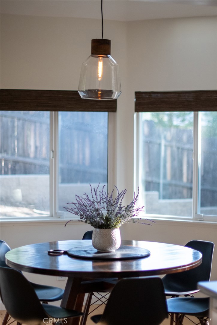 940 Highway 173 Lake Arrowhead, CA 92352 - Photo 14 of 45 a view of a dining room with furniture window and wooden floor