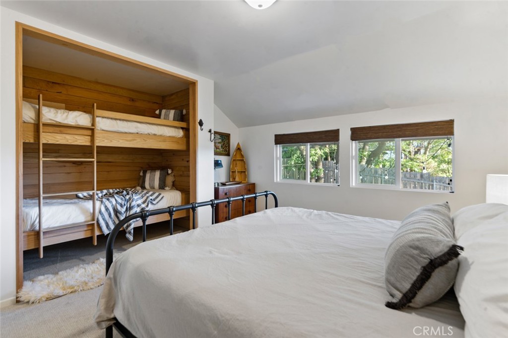 940 Highway 173 Lake Arrowhead, CA 92352 - Photo 27 of 45 a bedroom with a bed and a couch