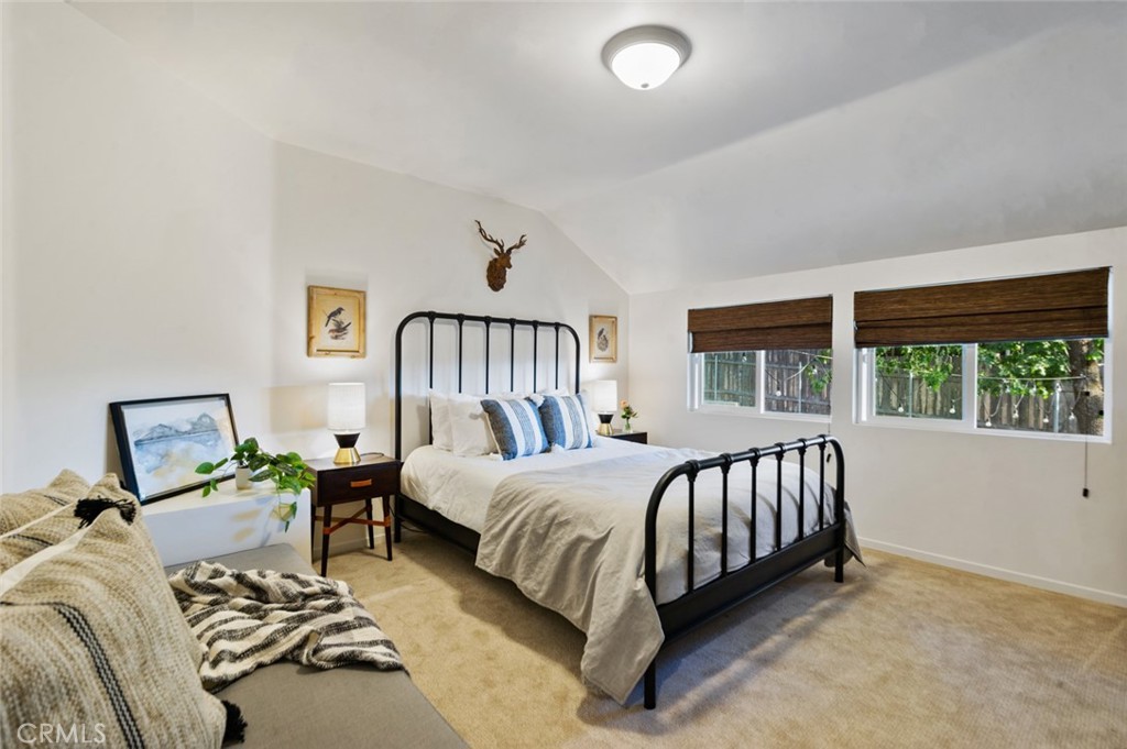 940 Highway 173 Lake Arrowhead, CA 92352 - Photo 31 of 45 a bed sitting in a bedroom next to a window