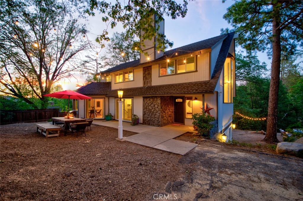 940 Highway 173 Lake Arrowhead, CA 92352 - Photo 42 of 45 a view of a park with table and chairs under an umbrella