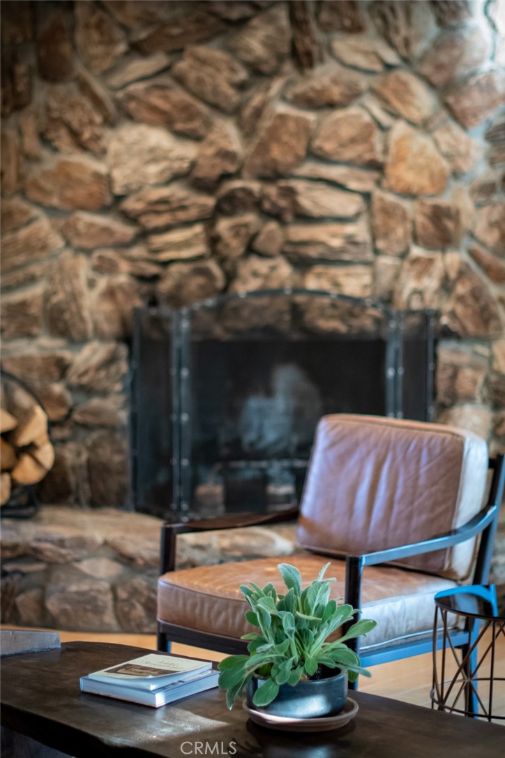 940 Highway 173 Lake Arrowhead, CA 92352 - Photo 6 of 45 a patio with table and chairs with potted plants