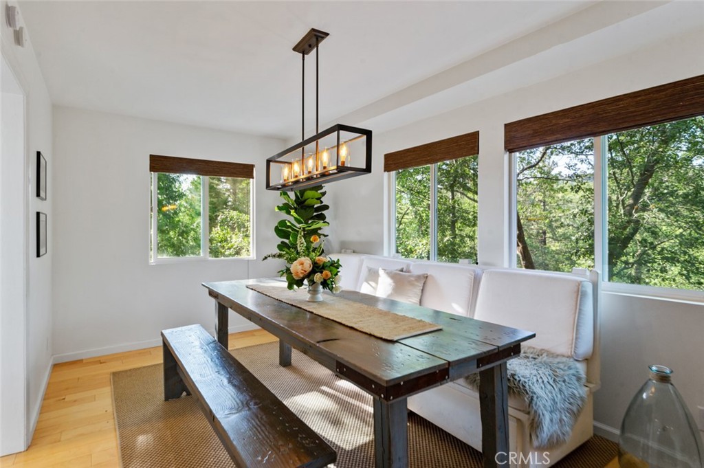 940 Highway 173 Lake Arrowhead, CA 92352 - Photo 8 of 45 a view of a workspace with furniture window and wooden floor