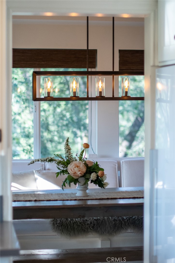 940 Highway 173 Lake Arrowhead, CA 92352 - Photo 9 of 45 a kitchen with a large window and cabinets