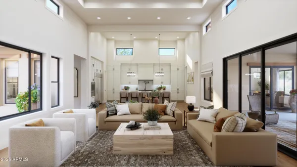 a kitchen with stainless steel appliances kitchen island granite countertop a table chairs sink and cabinets