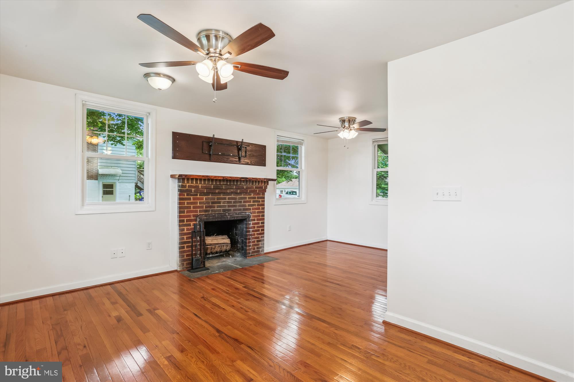 11008 Liberty Road Frederick, MD 21701 - Photo 12 of 39 a view of a livingroom with a fireplace and window