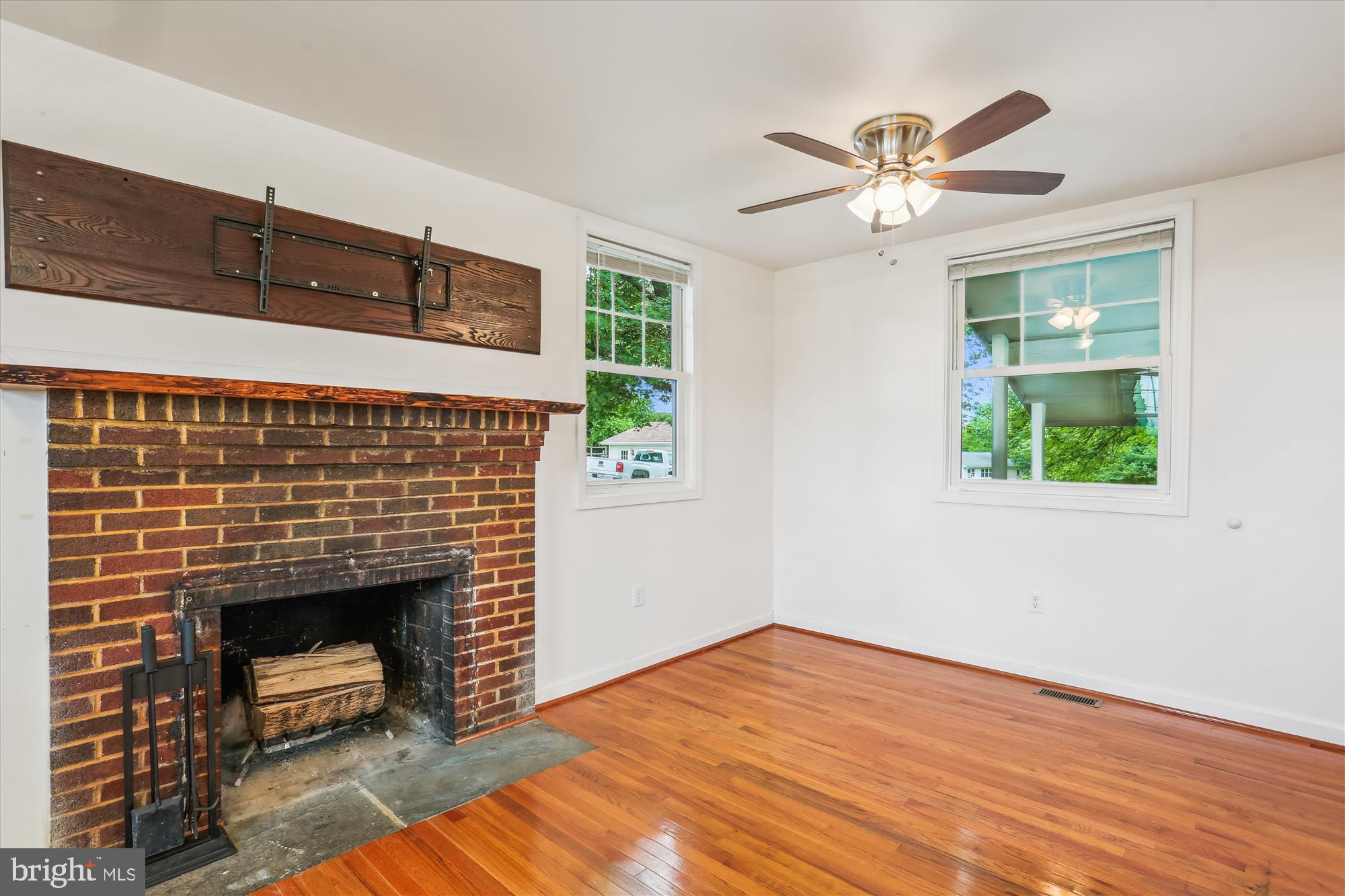 11008 Liberty Road Frederick, MD 21701 - Photo 13 of 39 a bedroom with a fireplace and a window