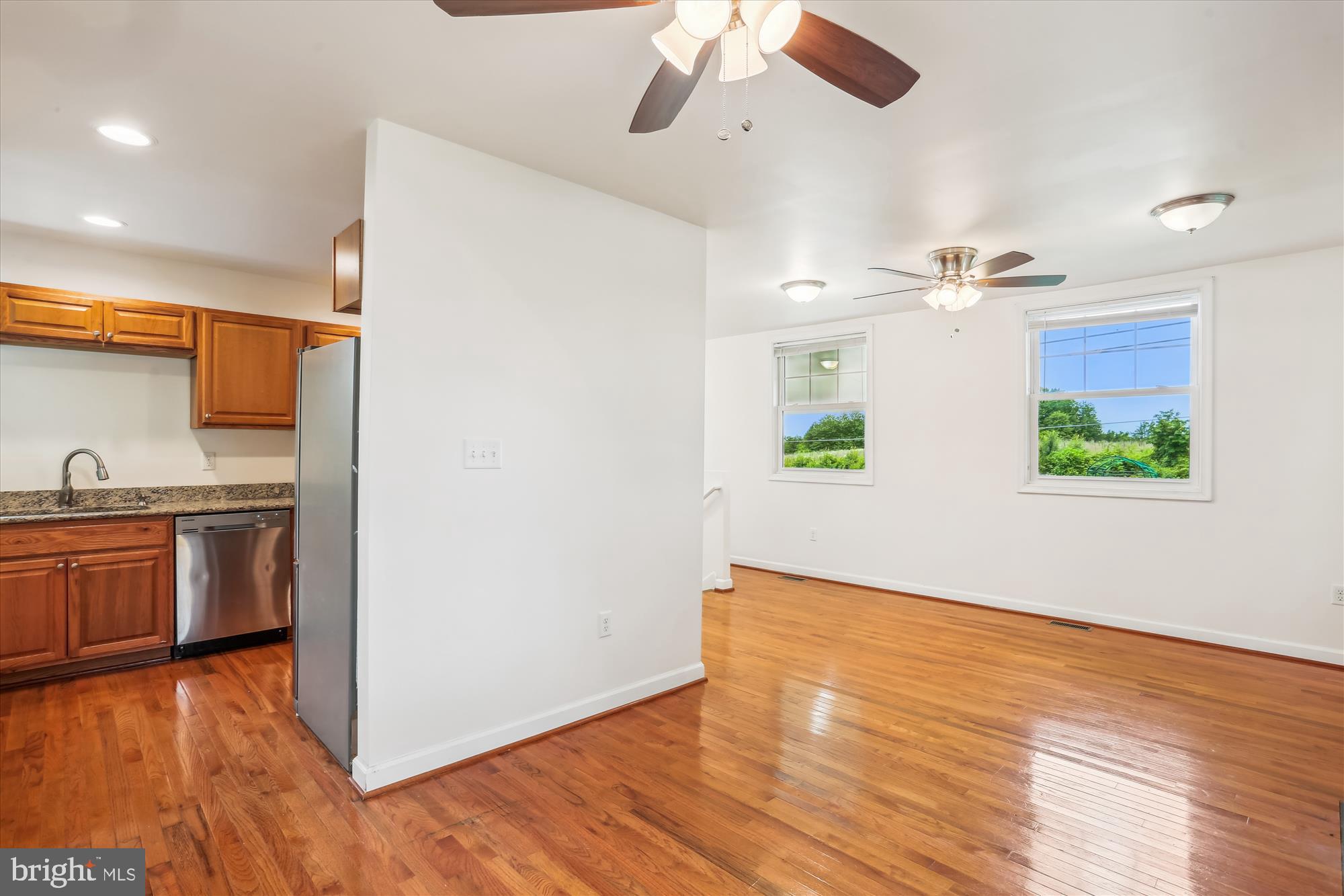 11008 Liberty Road Frederick, MD 21701 - Photo 15 of 39 a view of a kitchen with a sink hardwood floor and a kitchen counter top space