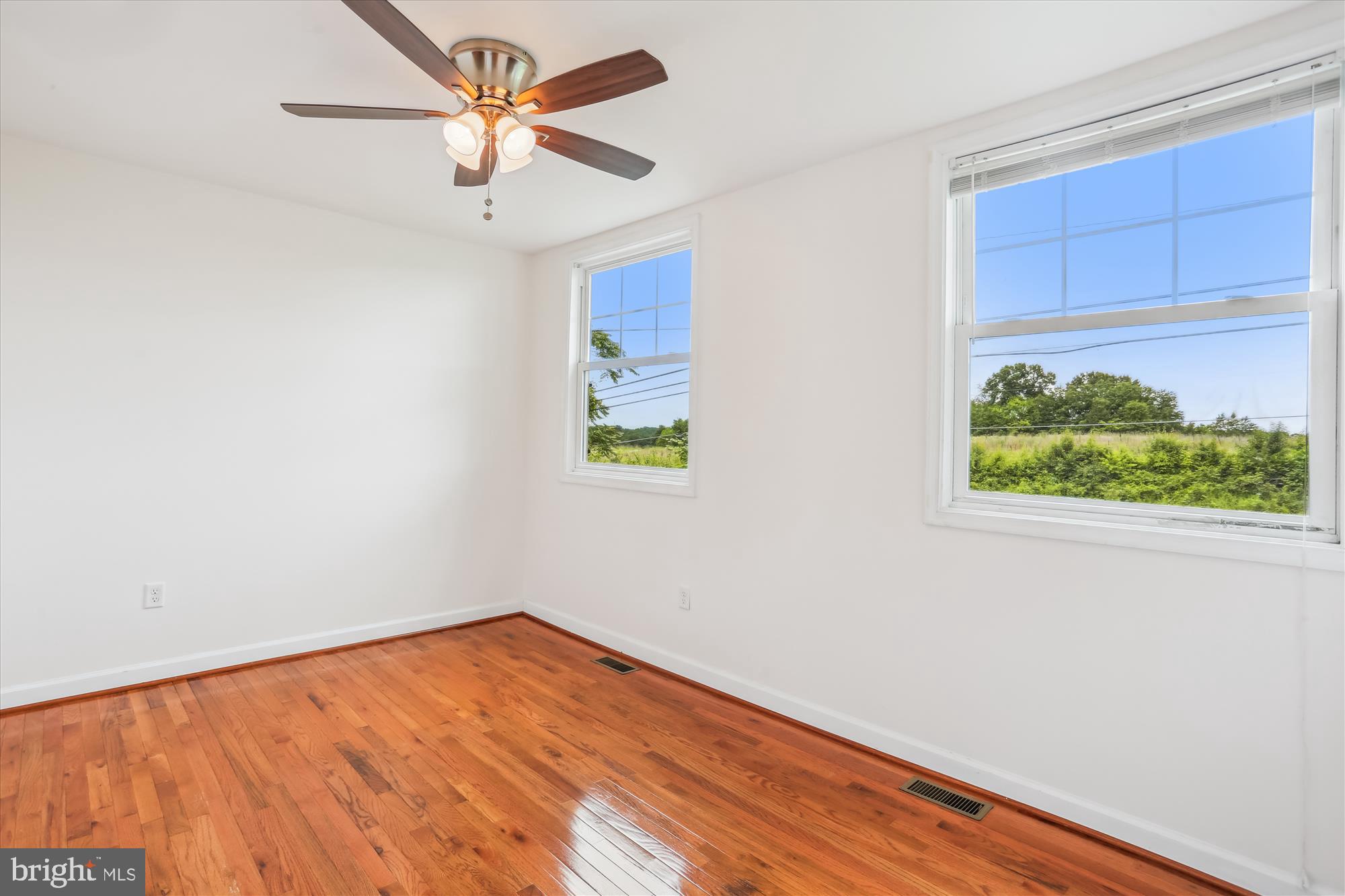 11008 Liberty Road Frederick, MD 21701 - Photo 20 of 39 an empty room with a window and a ceiling fan