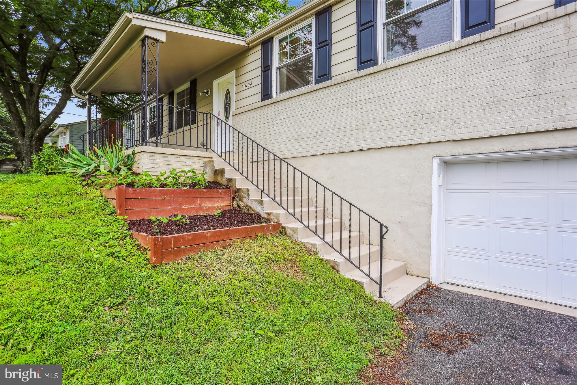 11008 Liberty Road Frederick, MD 21701 - Photo 2 of 39 a view of house with backyard and garden