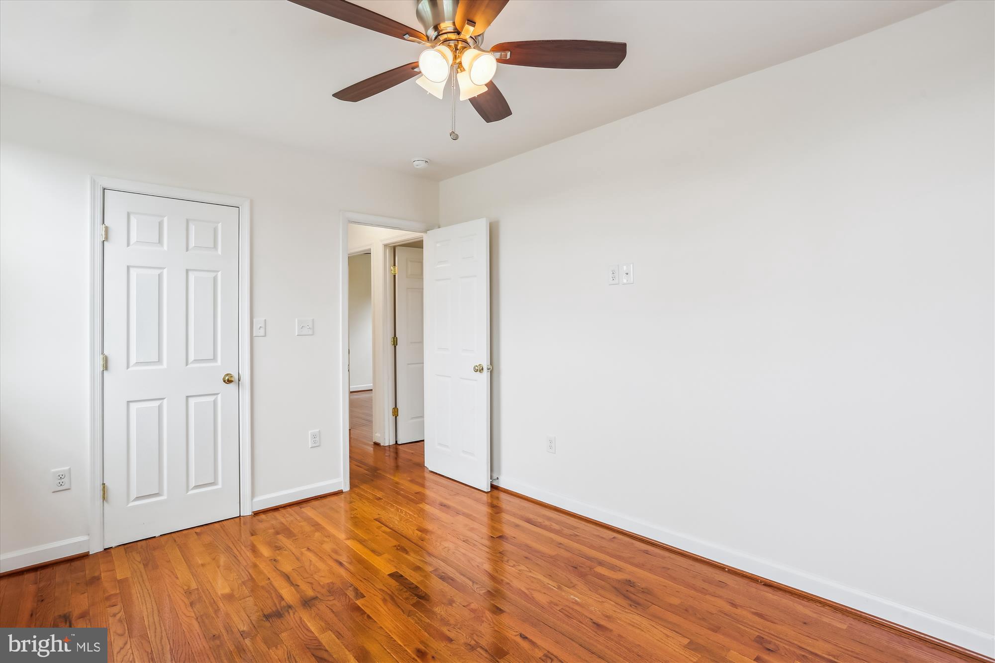11008 Liberty Road Frederick, MD 21701 - Photo 21 of 39 a view of an empty room with wooden floor
