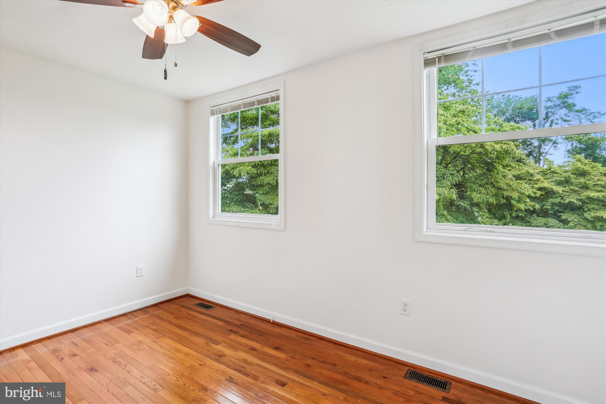 11008 Liberty Road Frederick, MD 21701 - Photo 24 of 39 an empty room with wooden floor fan and a window