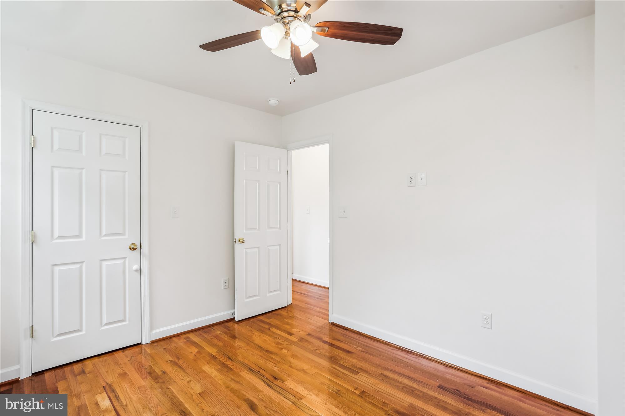 11008 Liberty Road Frederick, MD 21701 - Photo 25 of 39 a view of an empty room with wooden floor
