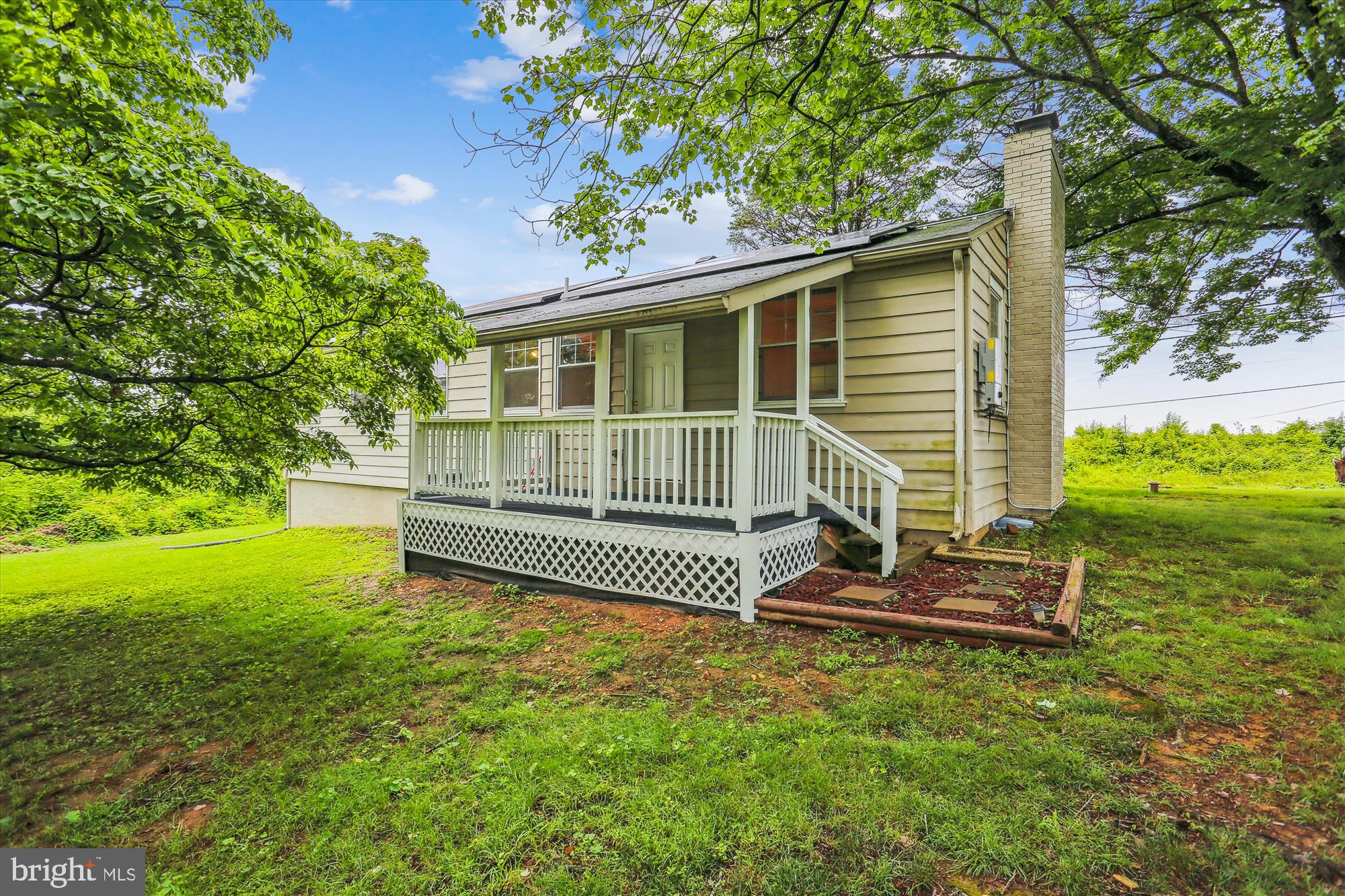 11008 Liberty Road Frederick, MD 21701 - Photo 36 of 39 a front view of a house with a garden
